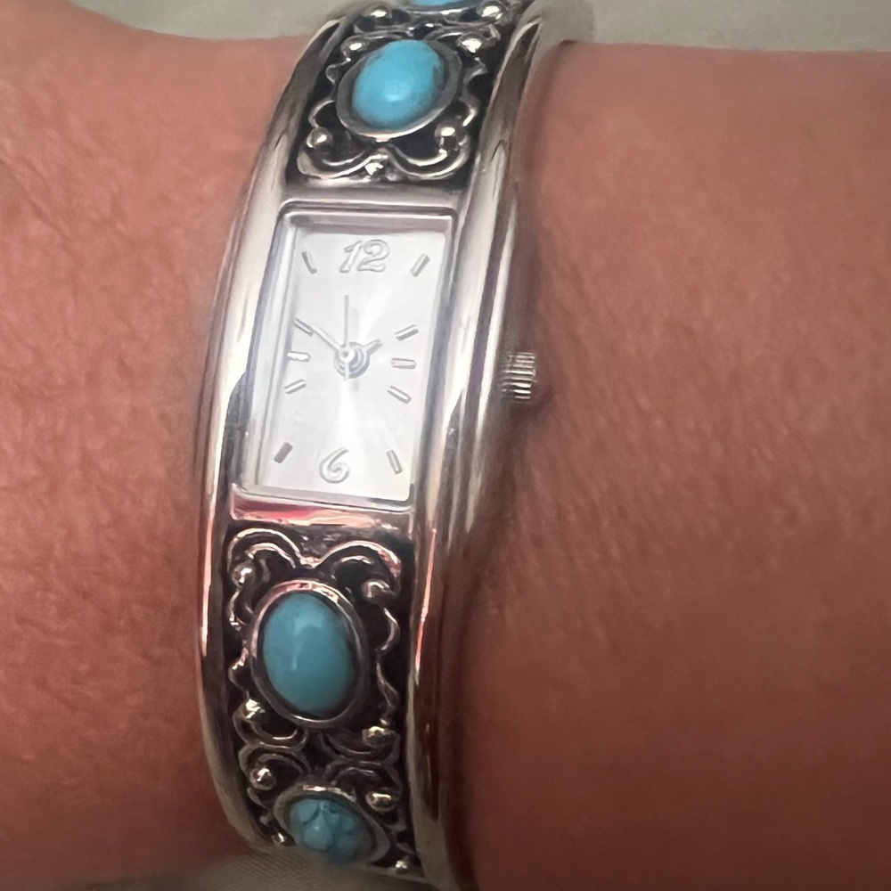 Watch with turquoise.